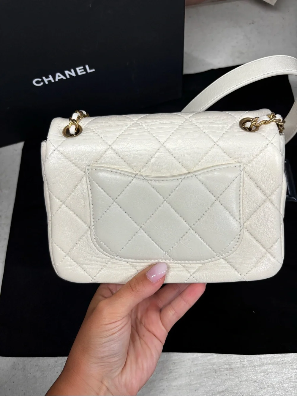 CHANEL White Quilted Leather Mini Flap Bag with Gold Chain Strap